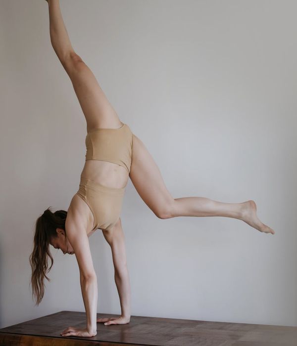 Man performing controlled strength exercise for core stability and balance.