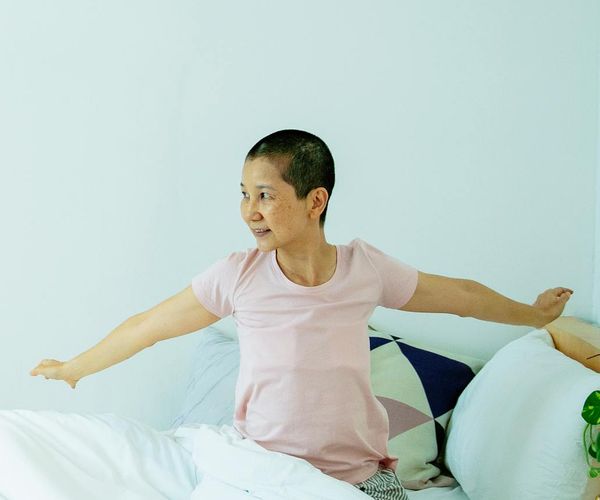 Smiling man enjoying outdoor morning exercise with energetic posture.